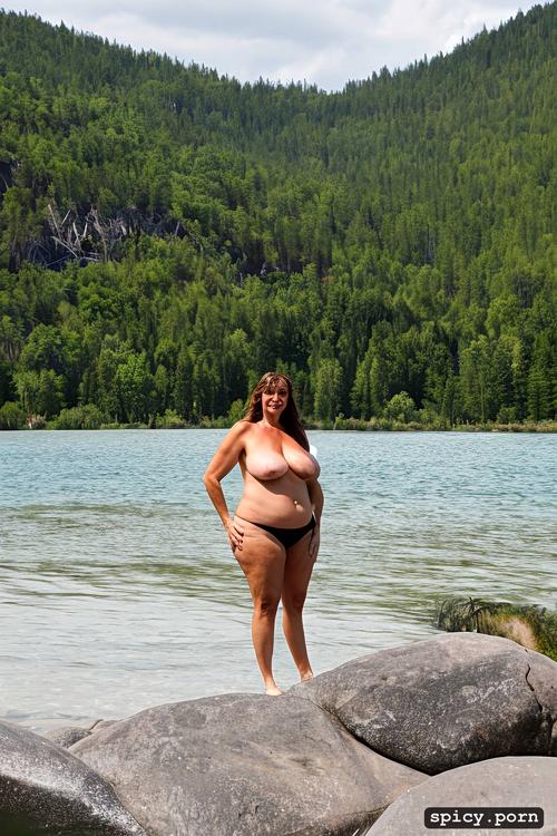 nude, perfect beautiful smiling face, color photo, standing straight at a mountain lake beach