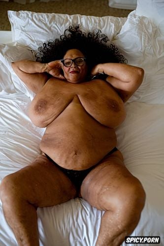 sitting is on bed, 8k shot, view from above looking big saggy old boobs in bed