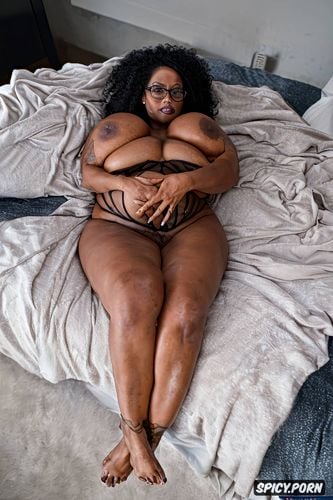 professionnal colored photography, saggy belly, sitting is on bed