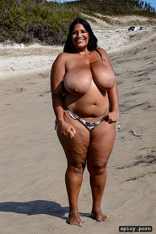 massive natural boobs, thick, full front view, standing at a beach