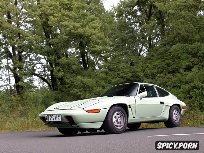one car, sharp bodylines, there is no one around, morning, front end is a porsche 928