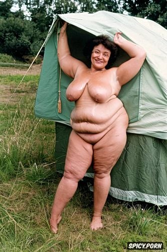 inside a tent, very wide hips, legs spread, smiling white woman