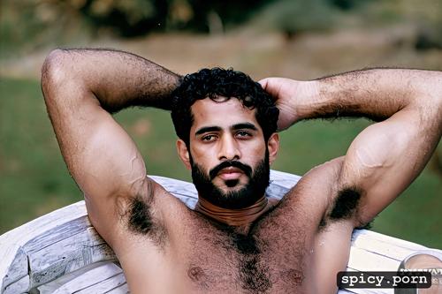 he is sitting on a chair, hairy athletic body, one alone naked athletic arab man