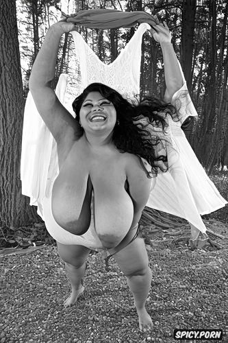 color photo, spread nude, laughing, gorgeous voluptuous italian model