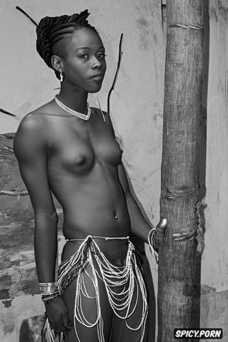 hair braided with beads, stunning ebony beauty, topless in traditional costume