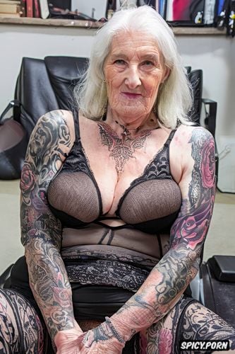 in her eighties, wrinkled skin, spreading legs, tattoos everywhere