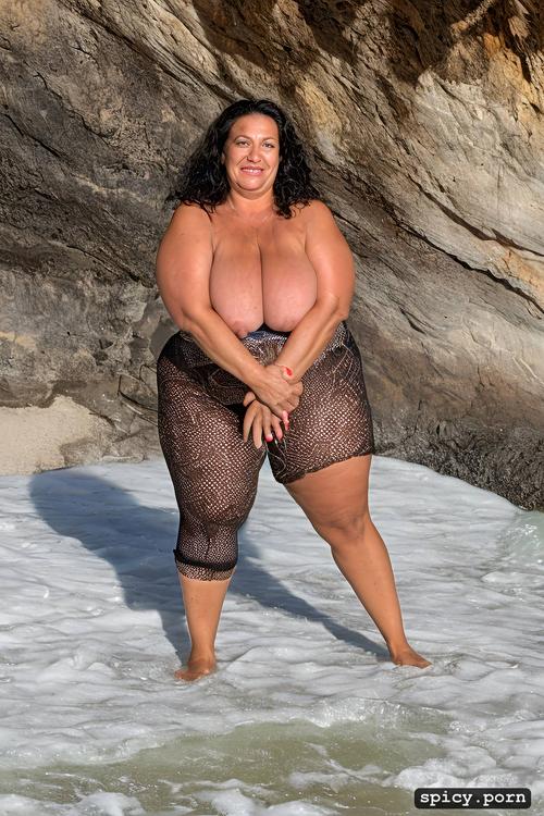 nude, wide hips, 51 yo, standing at a beach, hour glass figure