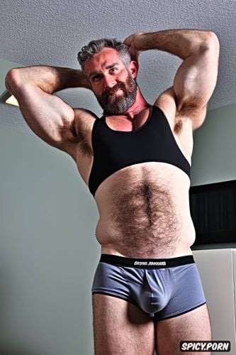 solo hairy gay muscular old man and perfect face beard showing hairy armpits indoors beefy chubby body wearing a tank top
