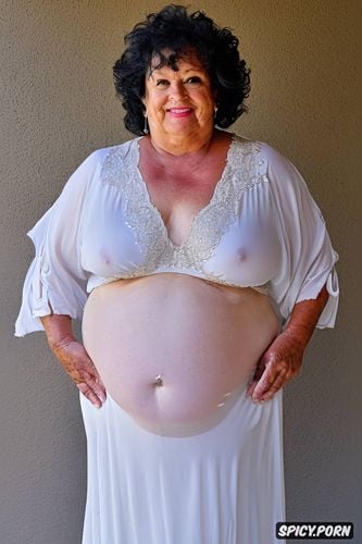 she lifts up her dress night gown with her hand to show her belly and pussy