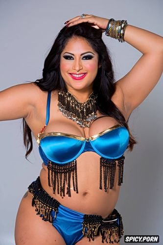 smiling, traditional two piece belly dance costume, gorgeous busty voluptuous belly dancer