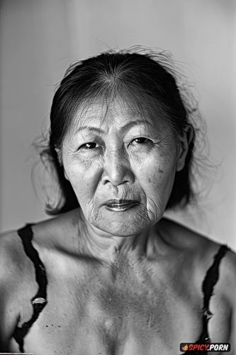 pov, super closeup, face photo 90 year old mongolian woman with round facial features and high cheekbones