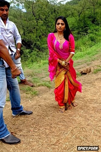 a new young real life bollywood female celebrity is pounced on by several panchayat men in a rural village