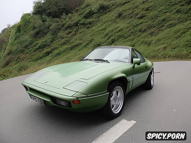 one car, front end is a porsche 928, morning, sharp bodylines