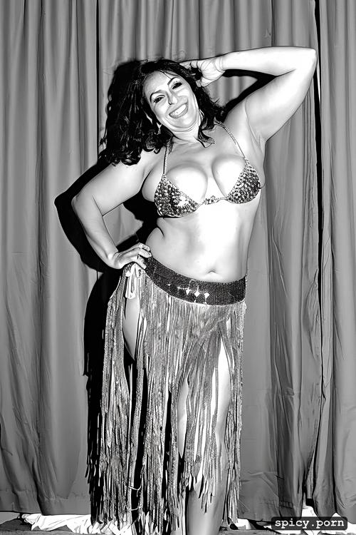 performing on stage, 49 yo very beautiful bellydancer, wide hips