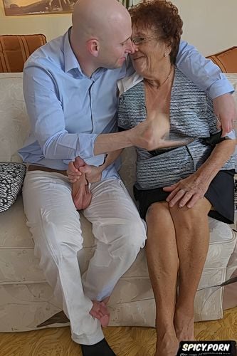 grabs her tits, saggy tits, glasses, gets handjob by 80 yo totally naked brunette granny