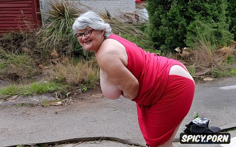 protruding belly, topless, in the background a ruined house