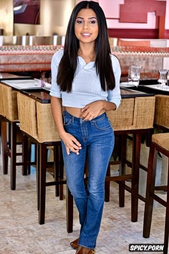 a young typical dusky indian waitress in america, wearing casual american clothes