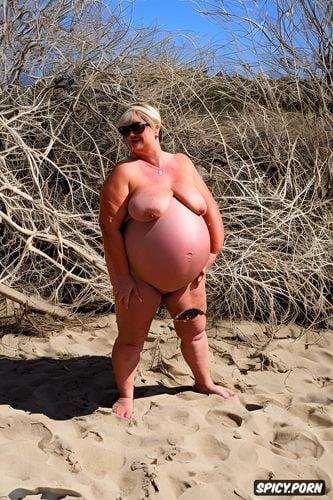 tanned, beach, sunglasses, blonde gilf, very wide hips, nude pregnant pissing