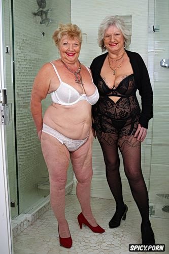 exhibitionist granny standing in bathroom of bedroom saggy tits short slutty looking and viewer smiling corset lingerie nude open silk robe