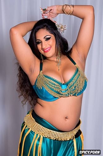 traditional two piece belly dance costume, smiling, gorgeous busty voluptuous belly dancer