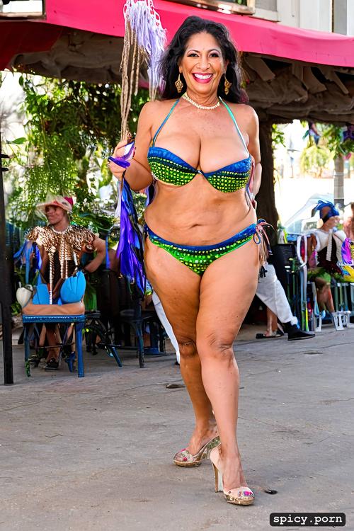 intricate beautiful costume with matching bikini top, 62 yo beautiful performing mardi gras street dancer