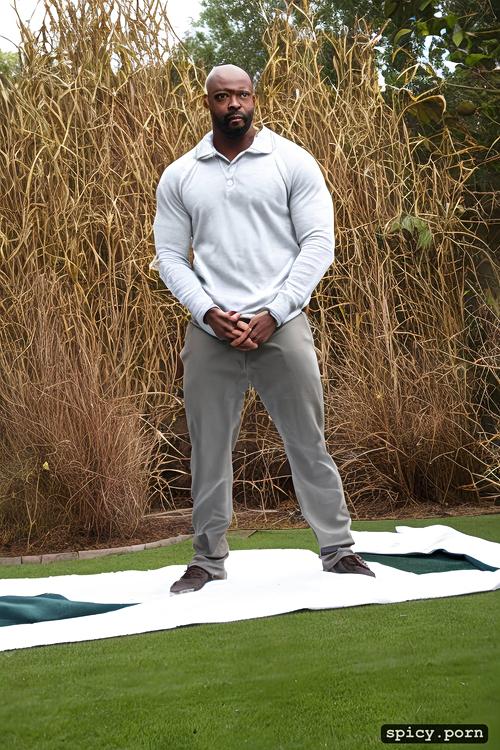 bodybuilder, bald, alone black man, standing on garden, 30 years old