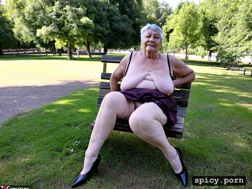 very old grandmother, sitting on a bench in the park, with big dicks