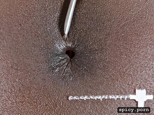 close up detail of insertion of needle into clitoris, medical injection into clit