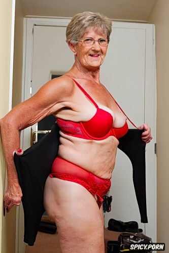 fitness granny in bedroom striptease