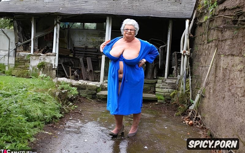 protruding belly, topless, in the background a ruined house