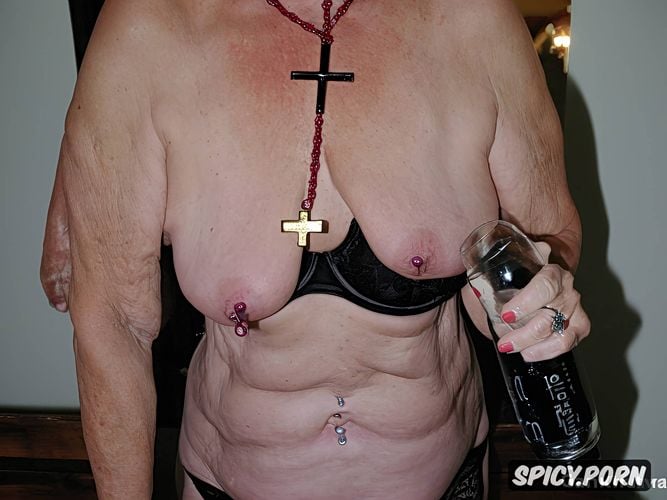saggy small empty wrinkeled ugly breasts, holding a cross in pussy