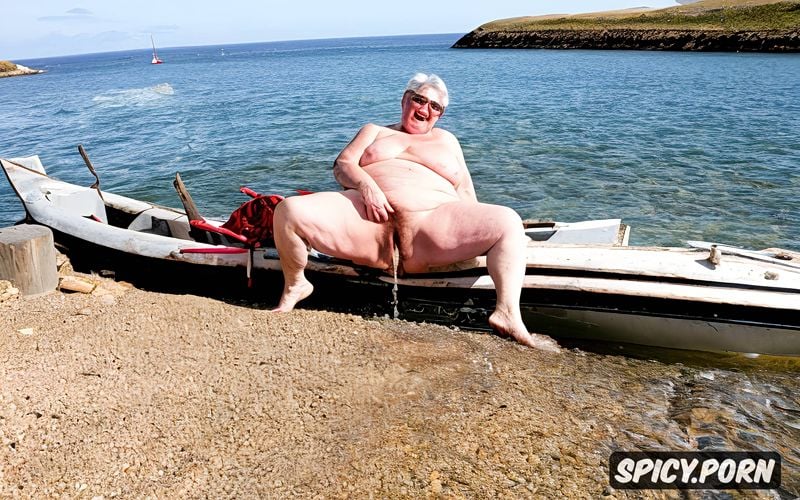 hairy pussy, sitting on a beach towel, obese, fat, very very old granny