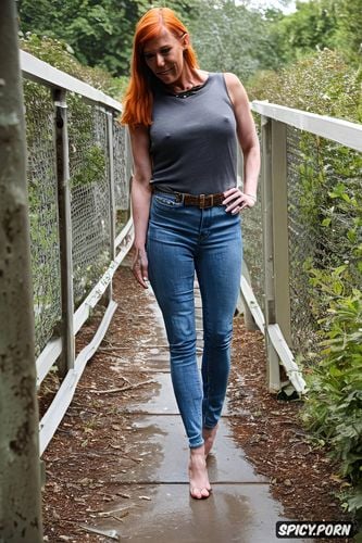 redhead, wearing a wet t shirt, nipples visible wearing jeans jeans lowered from the hips so that the pubic hair is visible alley in the park